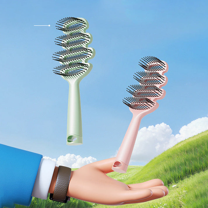 Curved hairbrush with ventilation