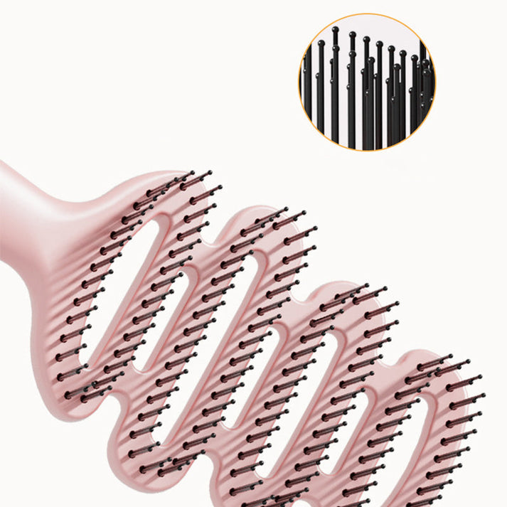 Curved hairbrush with ventilation
