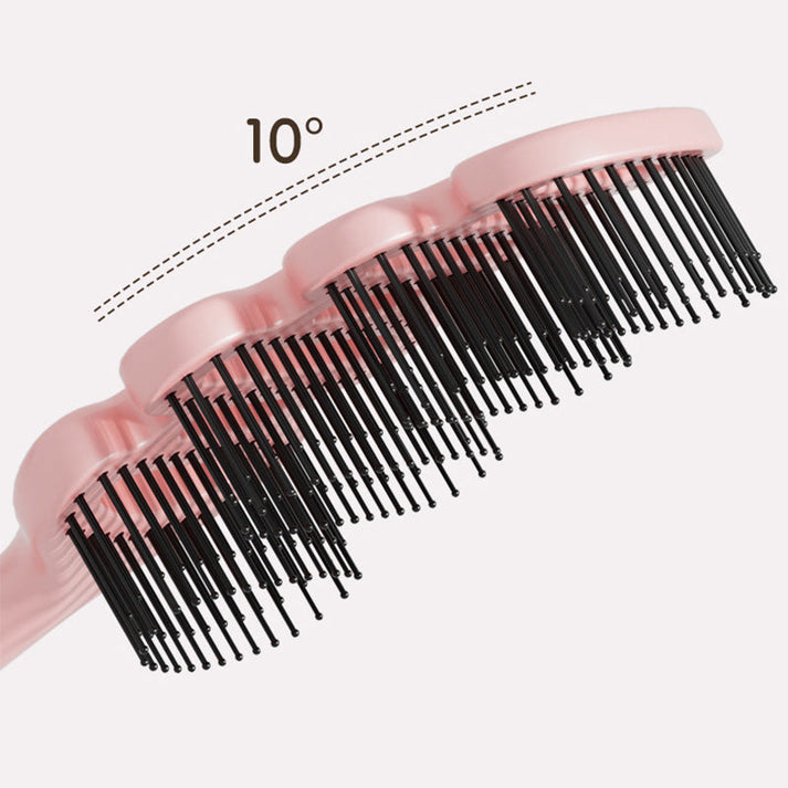 Curved hairbrush with ventilation