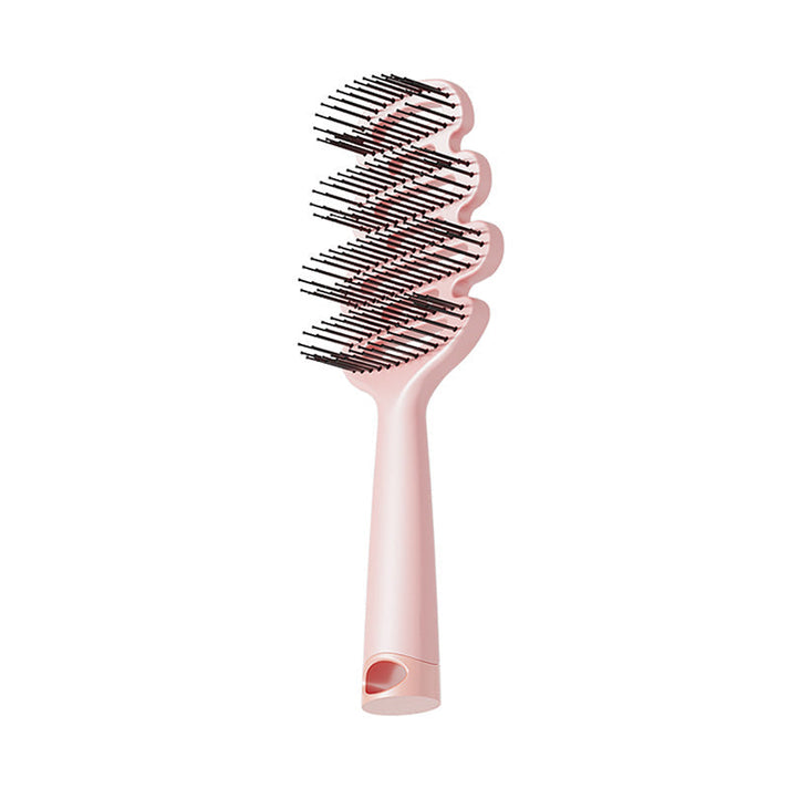 Curved hairbrush with ventilation