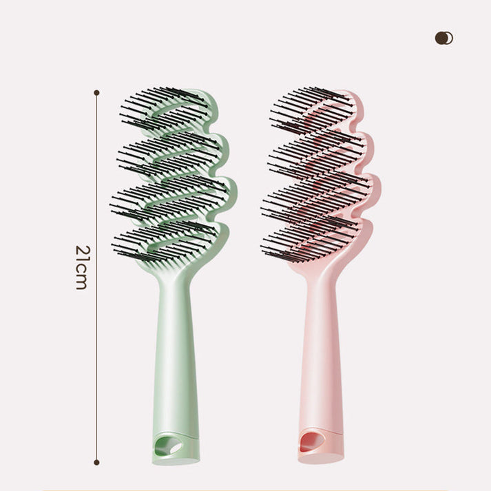 Curved hairbrush with ventilation